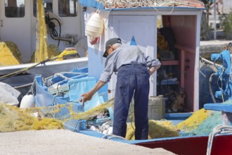 Fisherman at work, Livadi, Serifos Island, Cyclades Islands, Greece, Europe