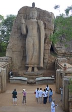 Visitors at the Avukana Buddha statue, Central Province, Sri Lanka, Asia