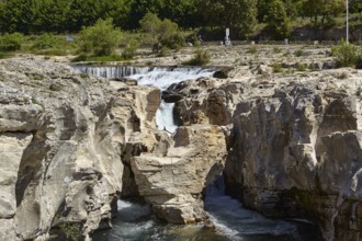 The cascades of Sautadet with limestone cliffs and the river Cèze in La Roque-sur-Cèze, Département