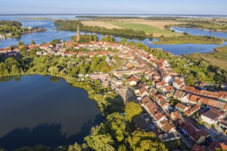 Aerial view of Röbel, lake Mönchteich in front, St. Mary's Church in center of town, lake Müritz,