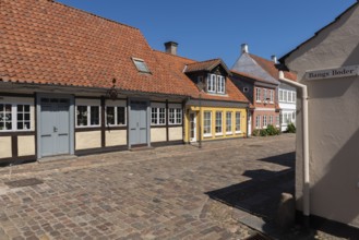 Odense, cobblestone street in the old town, half-timbered house, colourful houses, eaves houses,