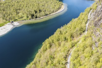 Aerial view of lake Lovatnet (or: Loenvatnet), gravel mountain road above the lake, valley Lodalen