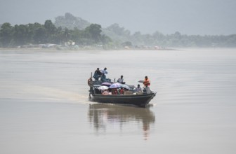 Morigaon, India. 4 July 2024. A boat carries a medical team in a flood affected village in Morigaon