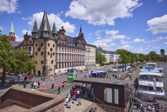 Saalhof with rent tower and excursion boats at the Mainkai under a blue sky with cumulus clouds in