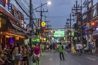 Crowds of people on Bangla Street in the evening. Nightlife on Bangla Walking Street with go-go