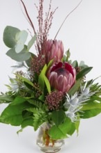 Bouquet with protea and eucalyptus in vibrant colours, stylish composition, bouquet