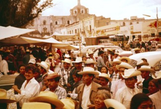 Crowds of people at a local festival in a small market town, Puebla state, Mexico 1961