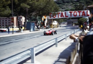 Formula 1 race Monaco Grand Prix 1961, Ferrari 156 F1 with shark nose passing the pits, motion blur