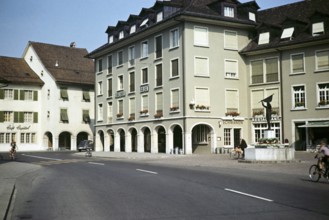 Historic buildings and Dornach fountain with statue, Dornach fountain, Rossmarktplatz, Solothurn,