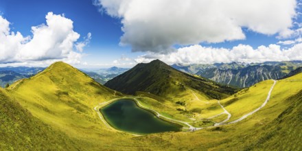 Riezler Alpsee, an artificial lake, snow pond, feeds the snow cannons that completely cover the