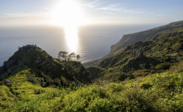 Evening mood, green coastal landscape on a steep cliff, sea and coast, viewpoint Miradouro da