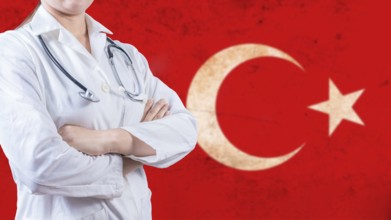 Healthcare concept with Turkish flag in background. Portrait of doctor with crossed arms with