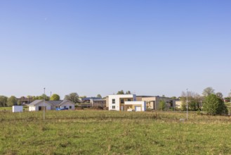 Newly built houses in a new residential area on a meadow near a town, Sweden, Europe