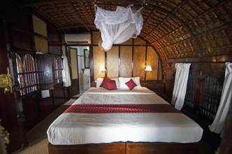 Sleeping cabin of a traditional houseboat on Lake Vembanad, canal system of the backwaters, Kerala,