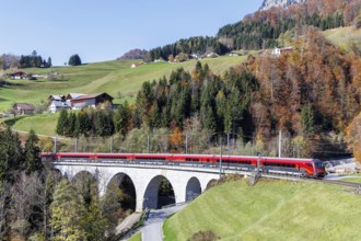 Railjet railway passenger train of the Austrian Federal Railways ÖBB on the Arlbergbahn in autumn