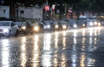 Drivers jam up on Potsdamer Strasse in heavy rain. After weeks of heat, the first heavy rain and