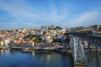 View of Porto city and Douro river and Dom Luis bridge I with metro tram from famous tourist