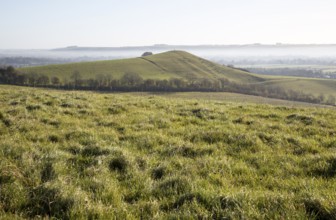 Picked Hill chalk outlier landscape misty valley floor, Vale of Pewsey, from Woodborough Hill,