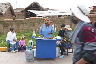 Barbecue stall at the traditional market in Cocotos on Lake Titicaca, Puno province, Peru, South