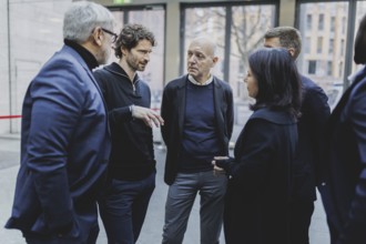 (L-R) Jimmy Hartwig, former professional footballer, Arne Friedrich, Bernd Neuendorf, President of