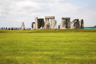 Large numbers of tourists visiting the World Heritage neolithic site of standing stones at