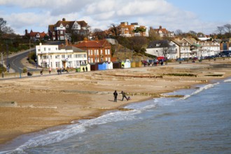 Sandy beach and historic buildings on the seafront on a sunny day in winter at Felixstowe, Suffolk,