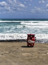 Red outdoor bar table, jug, bar with sea view, beach bar, Cabo de Gata Natural Park,