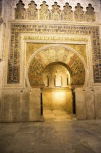 Richly inscribed stonework of keyhole shaped Mihrab, the centrepiece of the Great Mosque, Cordoba,