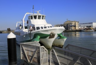 Passenger ferry boat Catamaran Bahia service arriving at Puerto de Santa de Maria, Cadiz province,