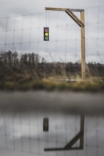 A gallows with a symbolic traffic light stands in a field near Gablenz, 14 Jan. 2024. As part of