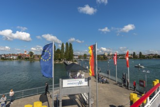 Immenstaad on Lake Constance, townscape, jetty, flags, name plate, blue sky, Baden-Württemberg,