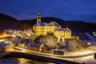 Winter evening in the Müglitz valley, impressively illuminated Weesenstein Castle at the blue hour,