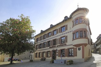 Historic Mohren Pharmacy built 17th century in backlight, building with corner turrets, turrets,