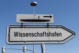 Sign pointing the way to Magdeburg Science Harbour, Saxony-Anhalt, Germany, Europe