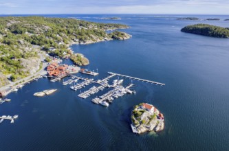 Aerial view of marina and single house on an island, southern norwegian coast, east of Kragerø, oil