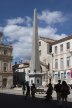 An obelisk stands on the Place de la Republique in Arles, Arles, Provence-Alpes-Côte d'Azur,