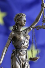 Symbolic image: Justitia in front of a European flag