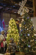 St. Thomas, Ontario Canada - Decorated Christmas trees and railway crossing are on display at the