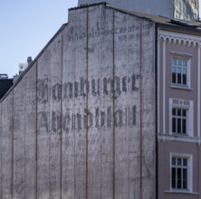 Advertisement on the fire protection wall of a residential building, Hamburg, Germany, Europe