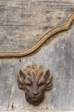 Door knocker on a dilapidated wooden gate, Galatina, Apulia, Italy, Europe