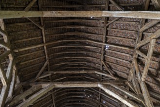 Interior showing wooden truss of 13th century Gothic monastic tithe barn of the Ter Doest Abbey at