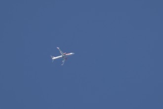 Boeing 737 jet passenger aircraft of Jet 2 holidays flying in a blue sky, England, United Kingdom,