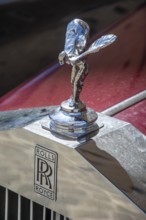 Hood ornament on a Rolls Royce automobile car