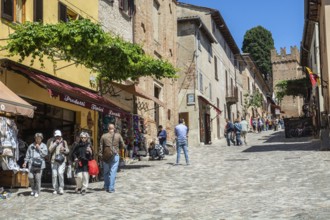 People on the central street in the medieval Gradara Castle, Marche, Italy, Europe