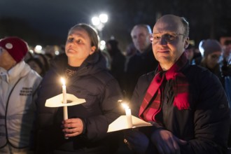 Participants with candles at the demonstration under the motto Sea of Lights against the shift to