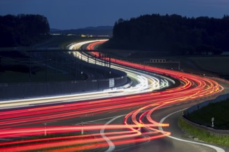 Tracers on the A8 motorway, winding road, evening, long exposure, Swabian Alb, Baden-Württemberg,