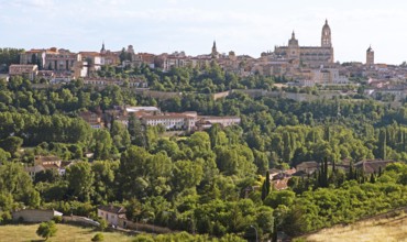 Segovia old town with the city wall and the cathedral in the evening, Province of Segovia, Castile