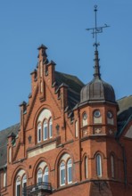 House with tower, gable and spire in brick architecture built in 1898 in Ystad, Skåne County,