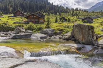 Wildbach Rein da Christallina near Medel. Chalet, wooden house in typical Swiss style. Medel,