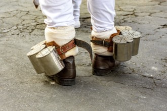 The rattle attached to the feet of the rhythmist is very common in some Afro-Brazilian cultural